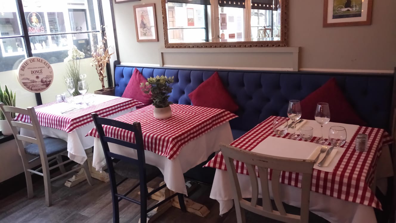 The real dining room at The French Pantry in Ludlow, with its red checked tablecloths