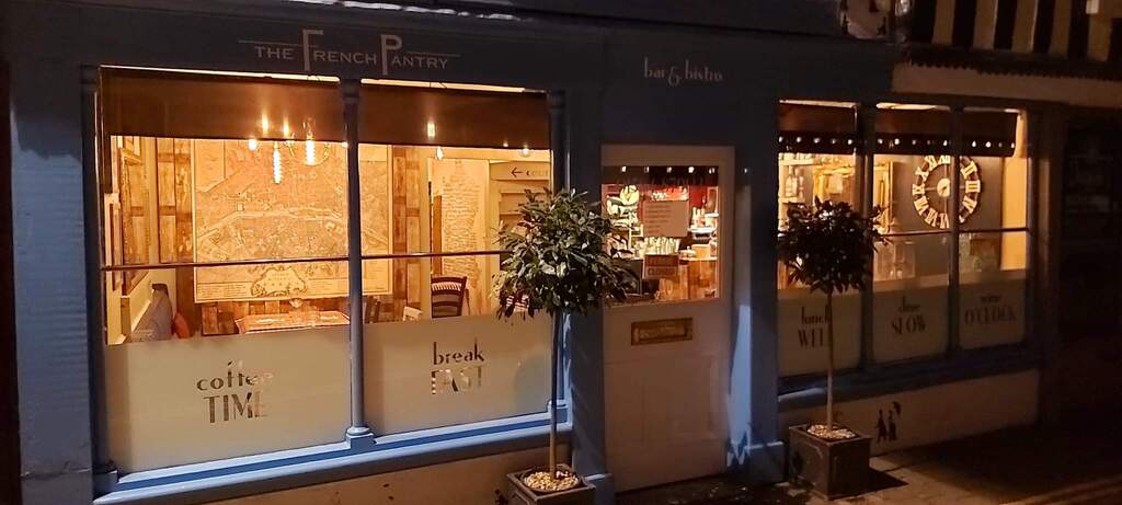 The French Pantry storefront on Tower Street at night